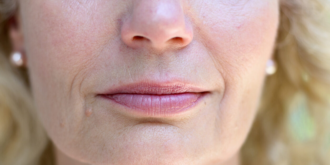Lower face of a senior lady with a quiet smile
